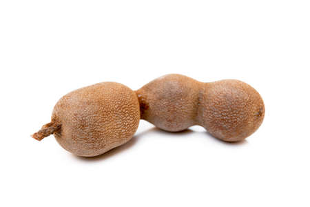 Ripe sweet tamarind isolated on white backgroundの写真素材