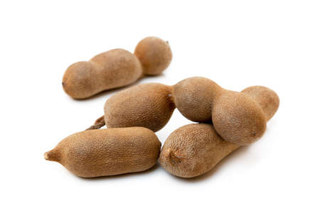 Ripe sweet tamarind isolated on white backgroundの写真素材