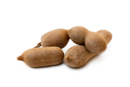 Ripe sweet tamarind isolated on white backgroundの写真素材