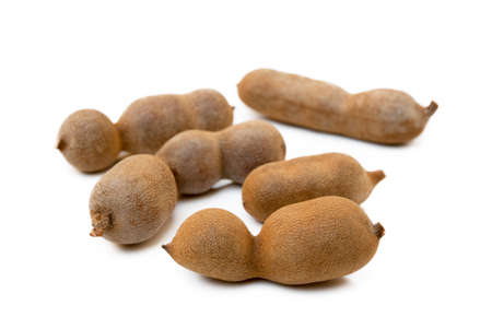 Ripe sweet tamarind isolated on white backgroundの写真素材