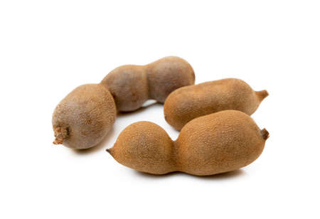 Ripe sweet tamarind isolated on white backgroundの写真素材