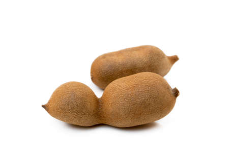 Ripe sweet tamarind isolated on white backgroundの写真素材