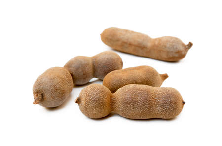 Ripe sweet tamarind isolated on white backgroundの写真素材