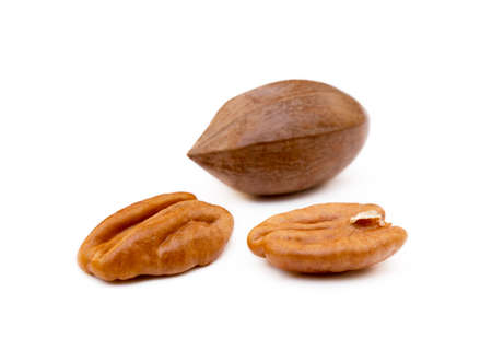 Fresh pecan nuts isolated on white backgroundの写真素材