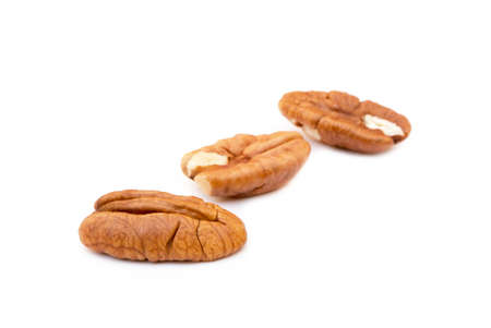 Fresh pecan nuts isolated on white backgroundの写真素材