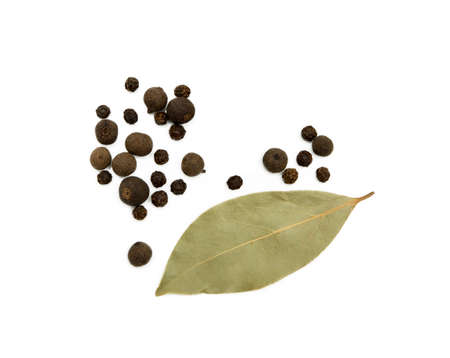 Bay leaf, allspice and pepper isolated on white backgroundの写真素材