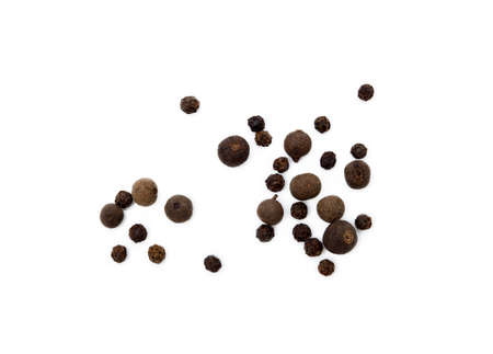 Scattered allspice and pepper isolated on white backgroundの写真素材