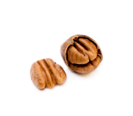 Fresh pecan nuts isolated on white backgroundの写真素材
