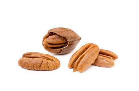 Shelled pecan nuts isolated on white background.の写真素材
