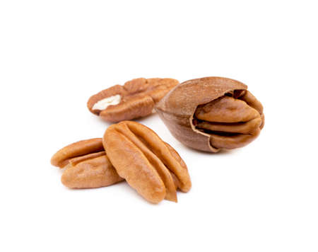 Shelled pecan nuts isolated on white background.の写真素材