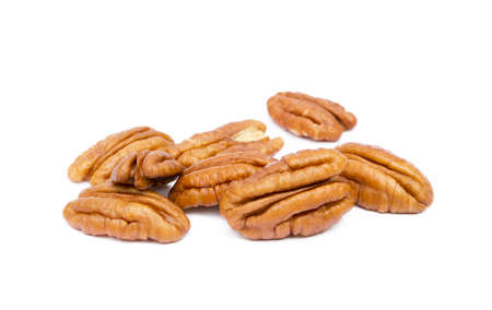 Shelled pecan nuts isolated on white background.の写真素材