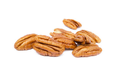 Shelled pecan nuts isolated on white background.の写真素材