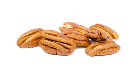 Shelled pecan nuts isolated on white background.の写真素材