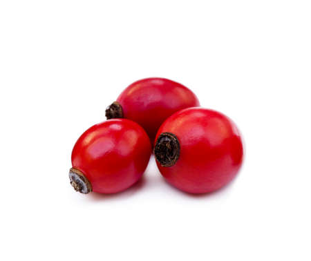 Ripe rose hip isolated on white backgroundの写真素材