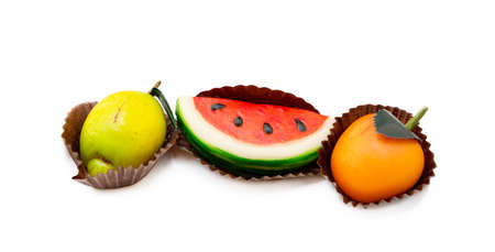 Fresh marzipan fruits isolated on a white backgroundの写真素材