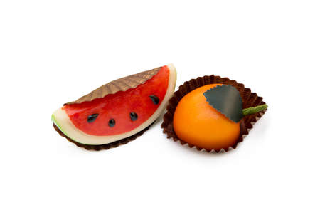 Fresh marzipan fruits isolated on a white backgroundの写真素材