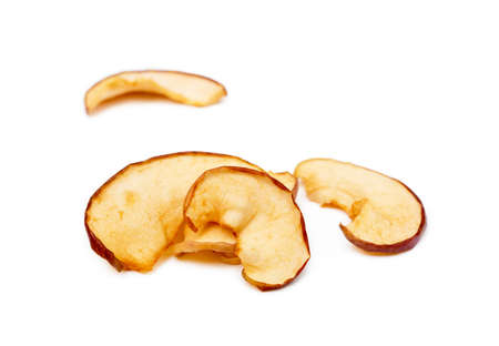 Dried sliced apples isolated on white backgroundの写真素材