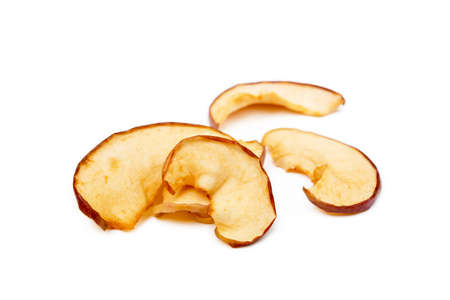 Dried sliced apples isolated on white backgroundの写真素材