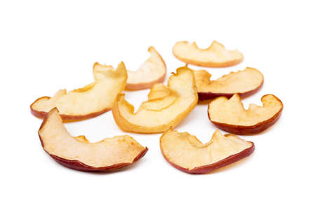 Dried sliced apples isolated on white backgroundの写真素材
