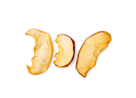 Dried sliced apples isolated on white backgroundの写真素材