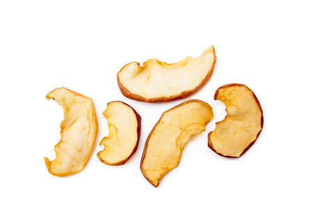 Dried sliced apples isolated on white backgroundの写真素材