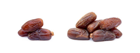 Dried sweet dates isolated on a white backgroundの写真素材