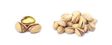 Pile of fresh pistachios isolated on white backgroundの写真素材
