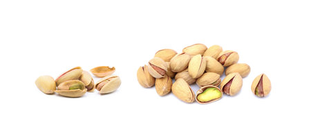 Pile of fresh pistachios isolated on white backgroundの写真素材