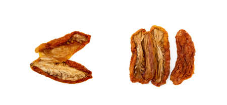 Dried red tomatoes isolated on white backgroundの写真素材