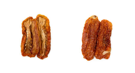 Dried red tomatoes isolated on white backgroundの写真素材