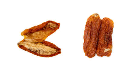 Dried red tomatoes isolated on white backgroundの写真素材