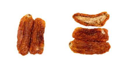 Dried red tomatoes isolated on white backgroundの写真素材