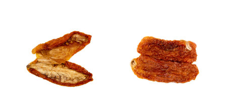 Dried red tomatoes isolated on white backgroundの写真素材