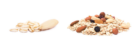 Mix nuts, raisins and oatmeal isolated on white backgroundの写真素材
