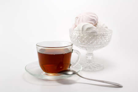 cup of black tea and fragrant white with a pink marshmallowの写真素材