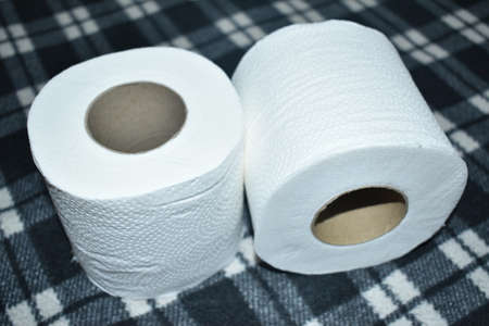 Closeup view of Toilet paper rolls isolated in black background