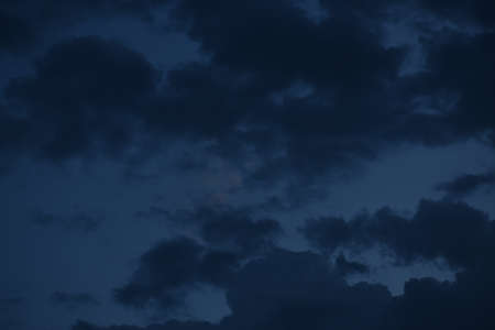 Dramatic sunrise and rainy storm sky with dark cloud.Abstract nature background.April 2020.
