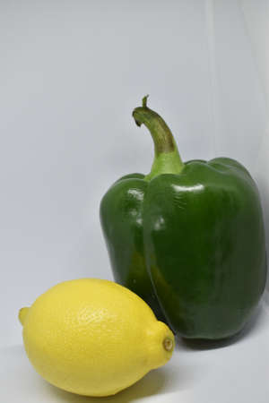 Capsicum and lemon isolated on white background.の写真素材
