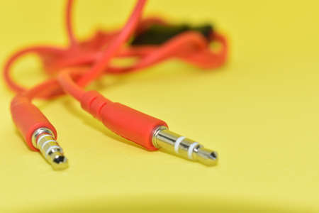 Red color cable in yellow background.