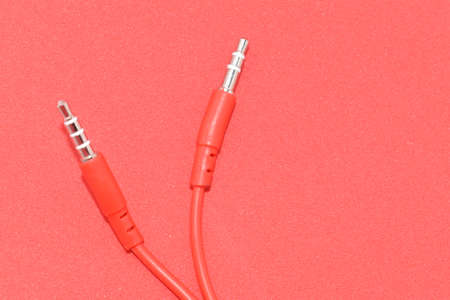 Red color cable isolated in red background.の写真素材