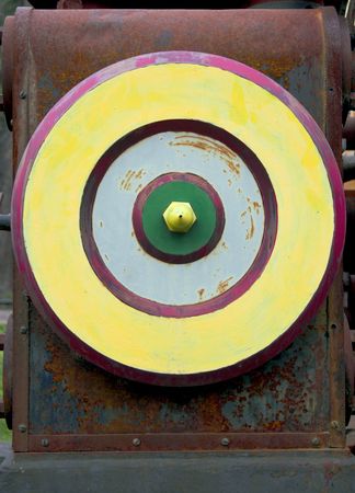 Multicolored wheel of the vintage rusty steam engine. の写真素材