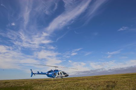 Helicopter in arctic tundra during polar summer の写真素材