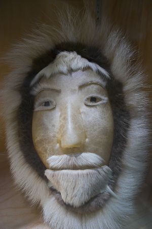 Traditional eskimo mask made of skin and furの写真素材