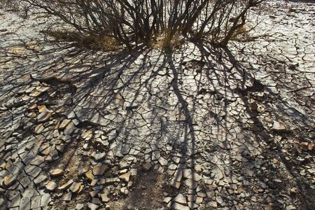 Fragment of black lava and ornage clay and salt mineral deposits in geological formations in Ubehebe Volcano, Death Valley National Parkの写真素材