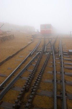 Railroad station at Pikes Peak in Colorado during snow, fog, rain and drizzle.の写真素材