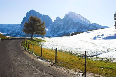 Road through snowy Alp region in Italyの写真素材