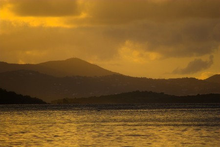 Sunset off the shore at equatorial island. Many of the photos in this series have been filtered using colored filters.の写真素材