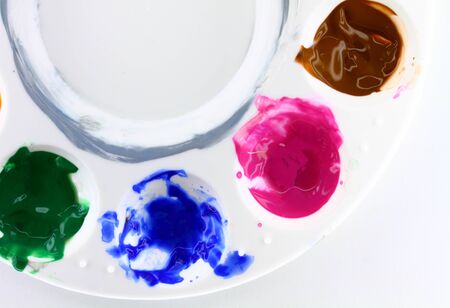 Round artist palette on white backgroundの写真素材