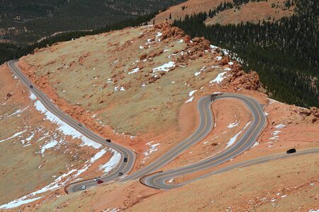 Beautiful serpentine road winding up to the Pikes Peak Mountain, Colorado, USAの写真素材