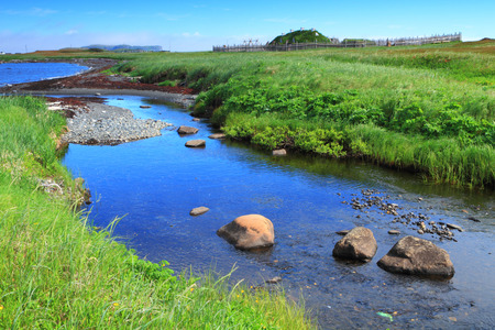 River flowing through ancient homes of Viking settlers in Lの写真素材